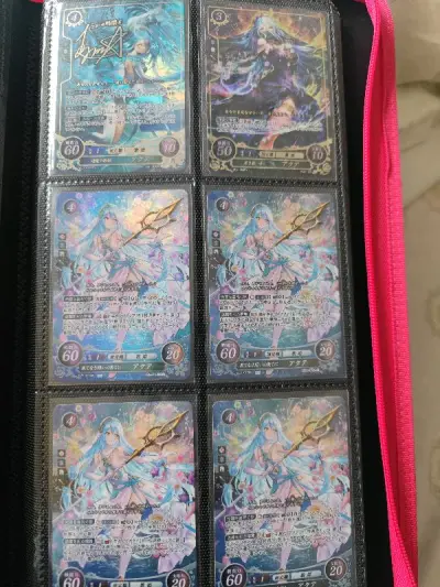 火纹的tcg真的蛮少的，阿库娅这张算是好价收到的。阿瓜是真的好看啊。买了四包游戏王tk05，竟然出了UR，这个太君好良心。现世离的卡套么懂得都懂，数了一下没有少张数的。不过这次又被税了，还好有点技术，不然税的人都要麻了。