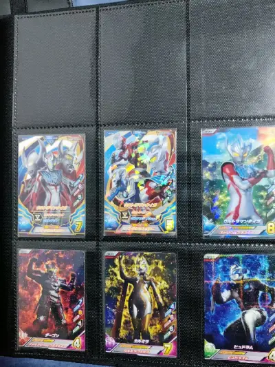 tp三张稀罕卡，闪耀赛罗UR。当时收藏最难的就这些。
t弹的CP构图是真的好。算是融合激战里我最喜欢的一套CP了。