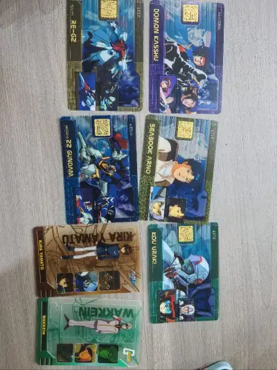 这批货真惊喜，几乎全部都是新的，无论是人物卡还是机体卡，几乎都是全新未拆封，只是有些被纸条绑住差点变形，但无大碍