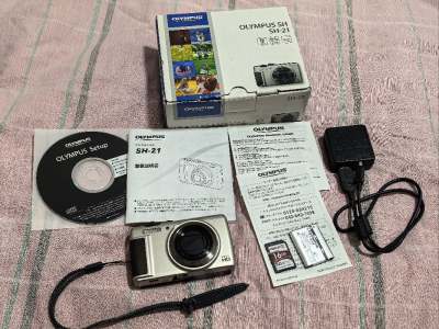 这次买的奥林巴斯SH21，外观成色还行，有略微磕碰，闪光灯有点问题，但是其他的还行，箱说全 带原箱，非常喜欢这种大全套的机子，合单也是蛮快的