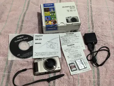 这次买的奥林巴斯SH21，外观成色还行，有略微磕碰，闪光灯有点问题，但是其他的还行，箱说全 带原箱，非常喜欢这种大全套的机子，合单也是蛮快的