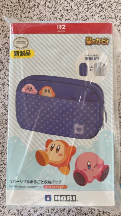 星之卡比用挖煤姬好价代购的swcih 2的保护包，双面的白色 紫色 用来装ns2非常合适 方便 全新没有任何磨损，感谢挖煤姬