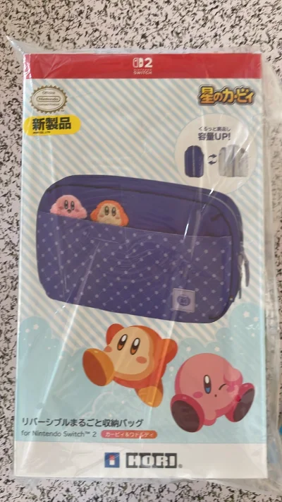 星之卡比用挖煤姬好价代购的swcih 2的保护包，双面的白色 紫色 用来装ns2非常合适 方便 全新没有任何磨损，感谢挖煤姬