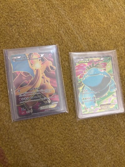 这两张卡 我看了好久了 终于降价 赶上好的优惠卷 顺利拿下 今天终于到我手里面了 很开心！我自己还有一张水箭龟 正好送个三连评级