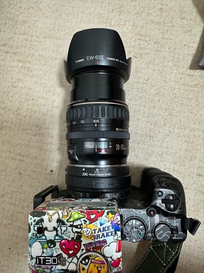 佳能28-105这款全是天涯镜了，出去旅游什么的非常方便，都不用带很多镜头，基本一支就够了，而且锐度还行，这个价格还要什么自行车