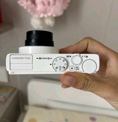 在挖煤姬低价拿下尼康P310，性价比直接拉满！机子成色很新，功能全正常，F1.8大光圈出片通透，对焦快、防抖也稳，日常扫街拍景都很够用。平台操作简单，汇率友好，打包严实无磕碰，物流也快。这个价格能淘到这样的CCD神机，太值了，挖煤姬靠谱，推荐冲！



