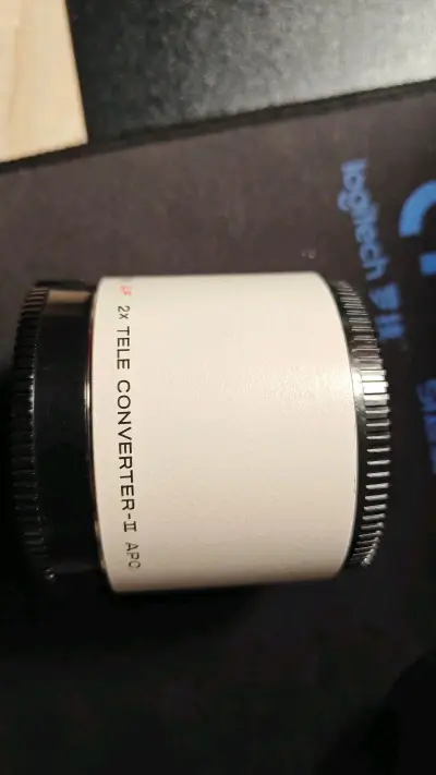 价廉物美，两件合一，省了不少钱。增距镜看上去很新，就是不知道为什么和200apo 合在一起，无法自动对焦，一会查一下资料。总的说，省钱，货真，值。