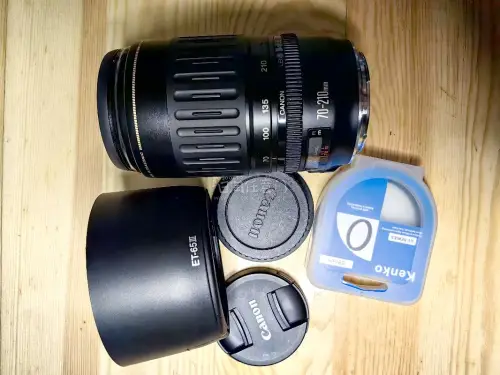 作为刚玩佳能老机身的穷学生，入手这两支EF长焦真的挖到宝了！55-200轻便好带，日常扫街、拍远景都够用，对焦速度在入门机上也能接受；70-210的画质惊喜更大，色彩很有老佳能的味道，虽然光圈不算大，但光线好的时候出片质感完全不输。两支都是平价入门长焦的好选择，适合...