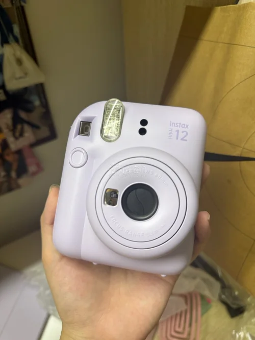 很漂亮的mini12，还带了17张相纸。310块钱的价格拿下，本来以为要被税了结果轻轻松松过关诶～
运费花了5块钱，喜欢挖煤姬的积分抵扣～超划算